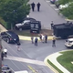 Law enforcement officials are seen outside the Capital Gazette offices in Annapolis, Md., after authorities say a gunman opened fire and killed at least five people.